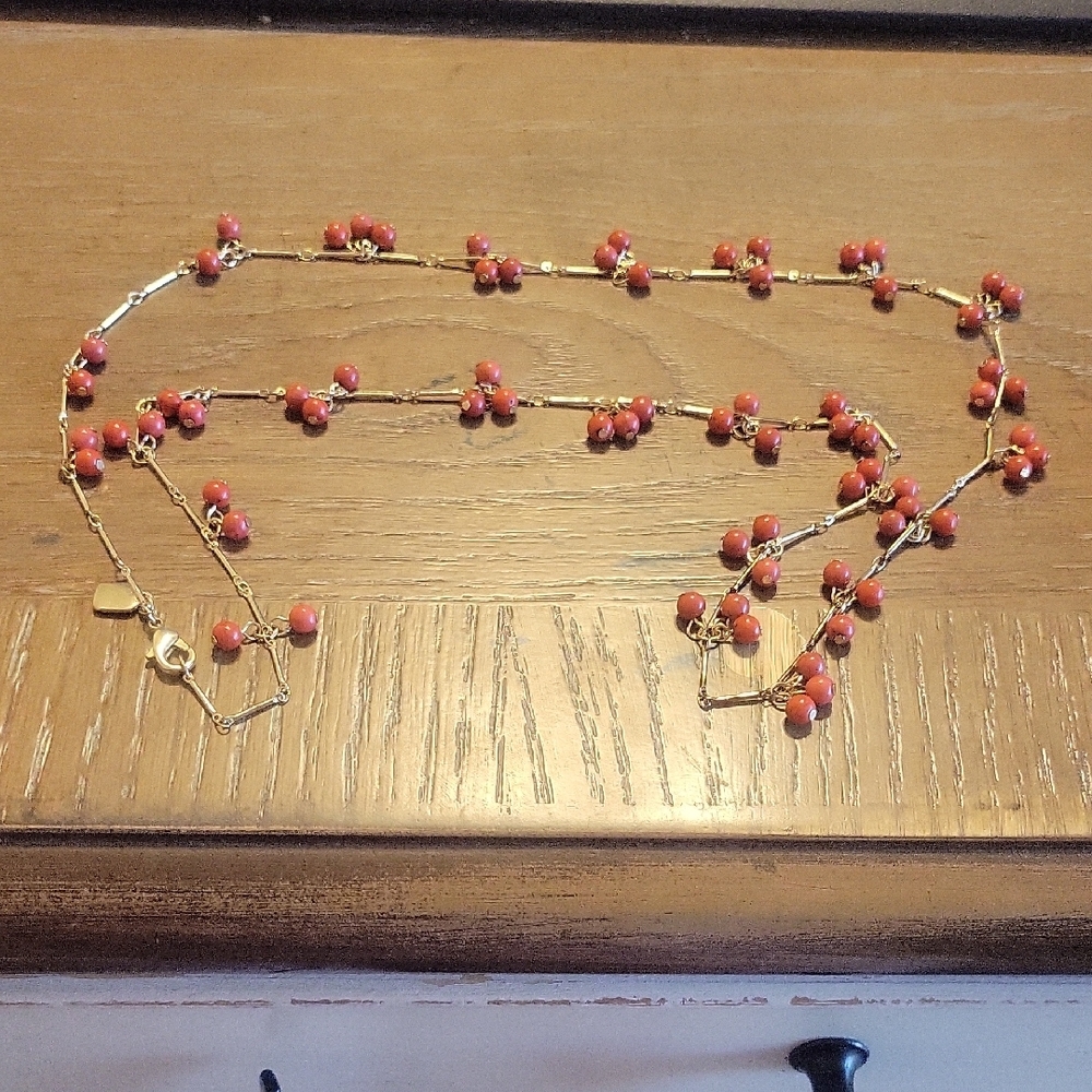Chaps Chic Coral tone Beaded Necklace has gold tone links thru